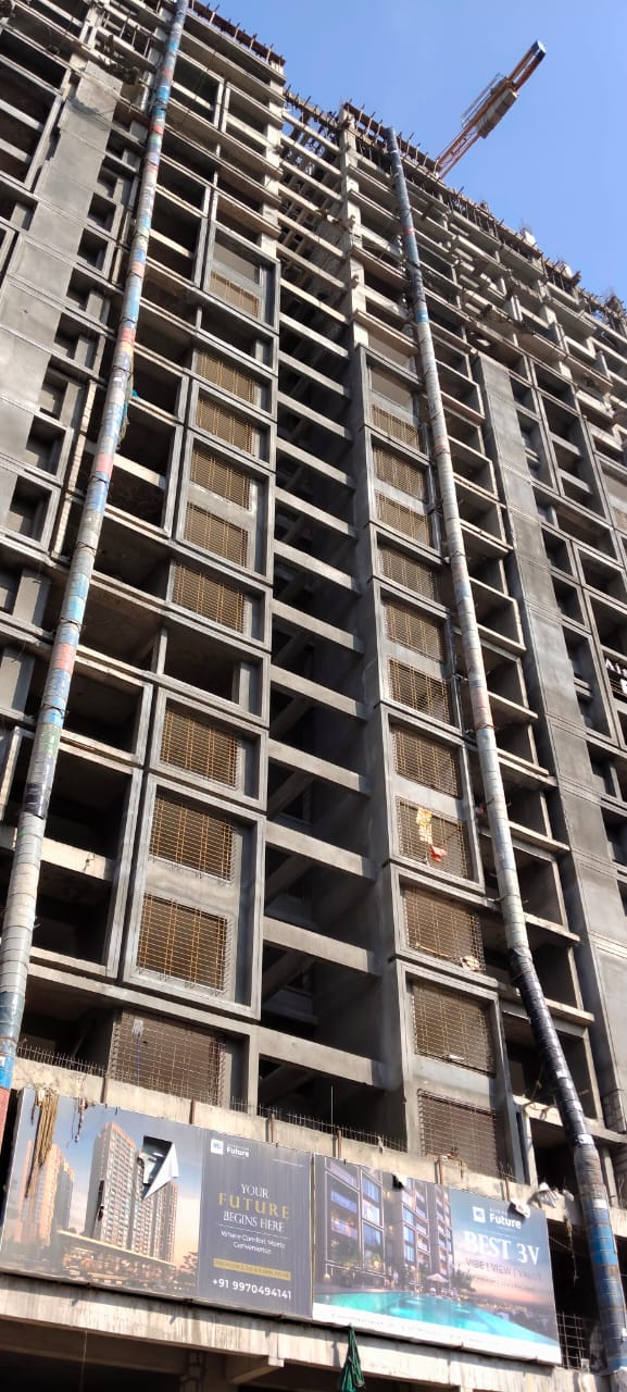 High-rise building debris chute installation running from the upper floors at a Pune construction site